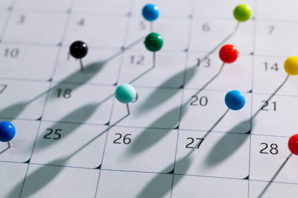 Colored pins on calendar showing a month