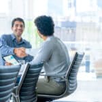 businessmen shake hands to close a deal