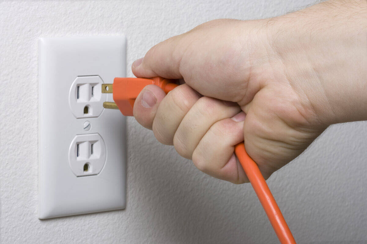 electrical cord plugs into wall socket for more energy