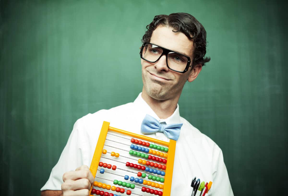 man in bowtie poses with abacus