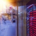 a sign flashes global stock data